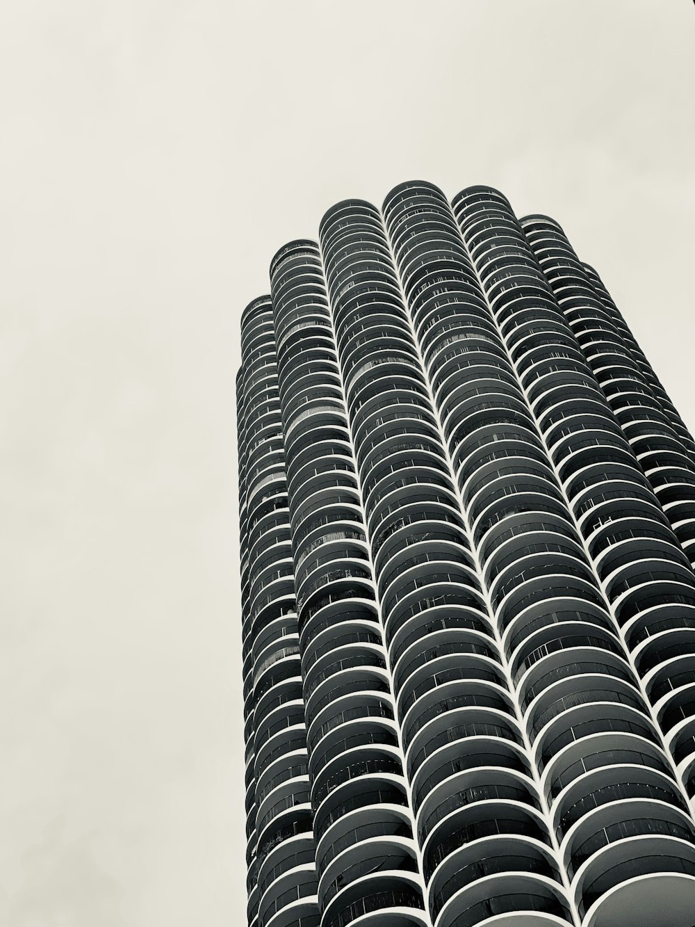 a tall building with a cloudy sky