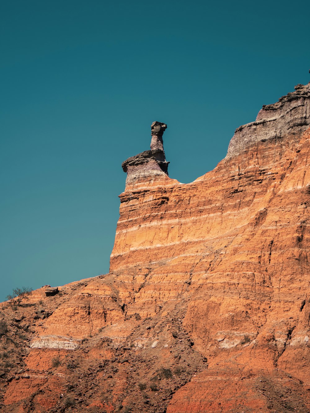 a statue on a rock