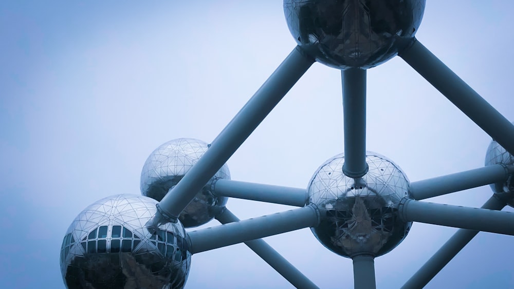 a group of large metal windmills