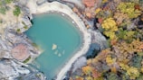 a body of water surrounded by rocks
