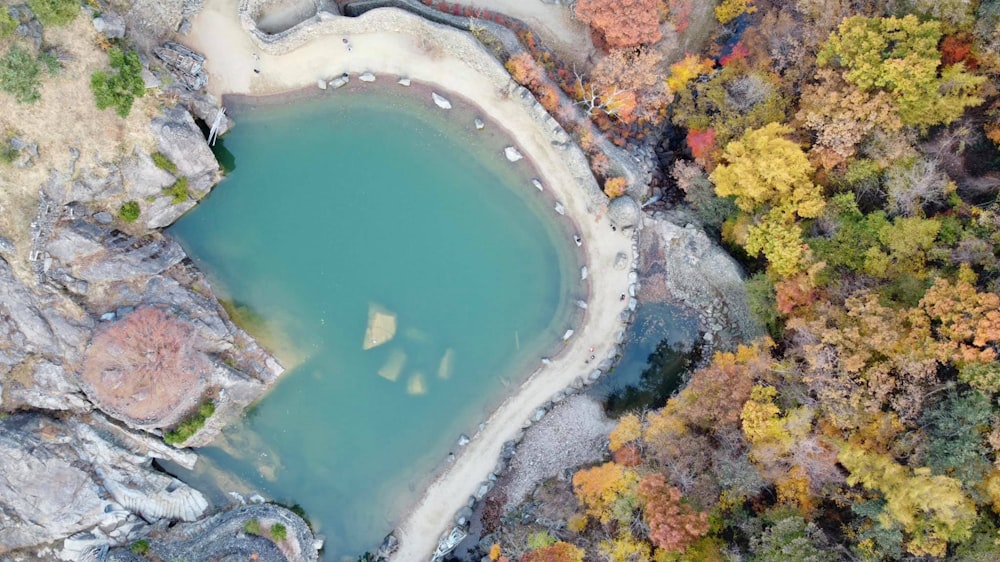 a body of water surrounded by rocks