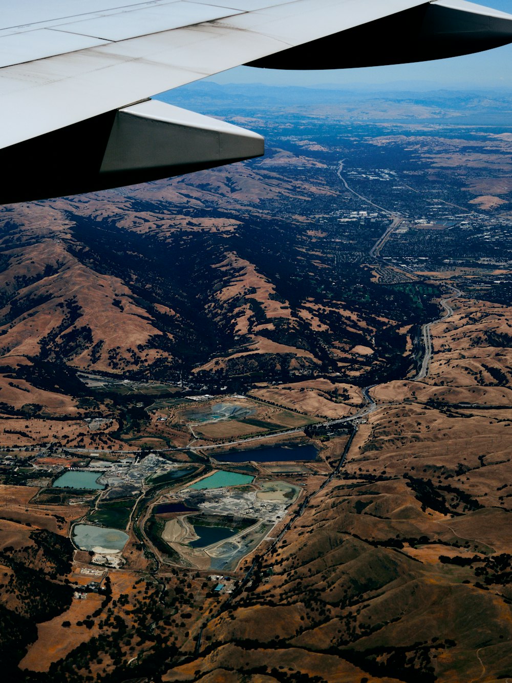 an airplane wing over a river