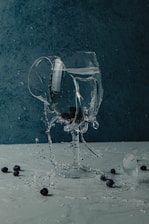 a glass of water with black liquid