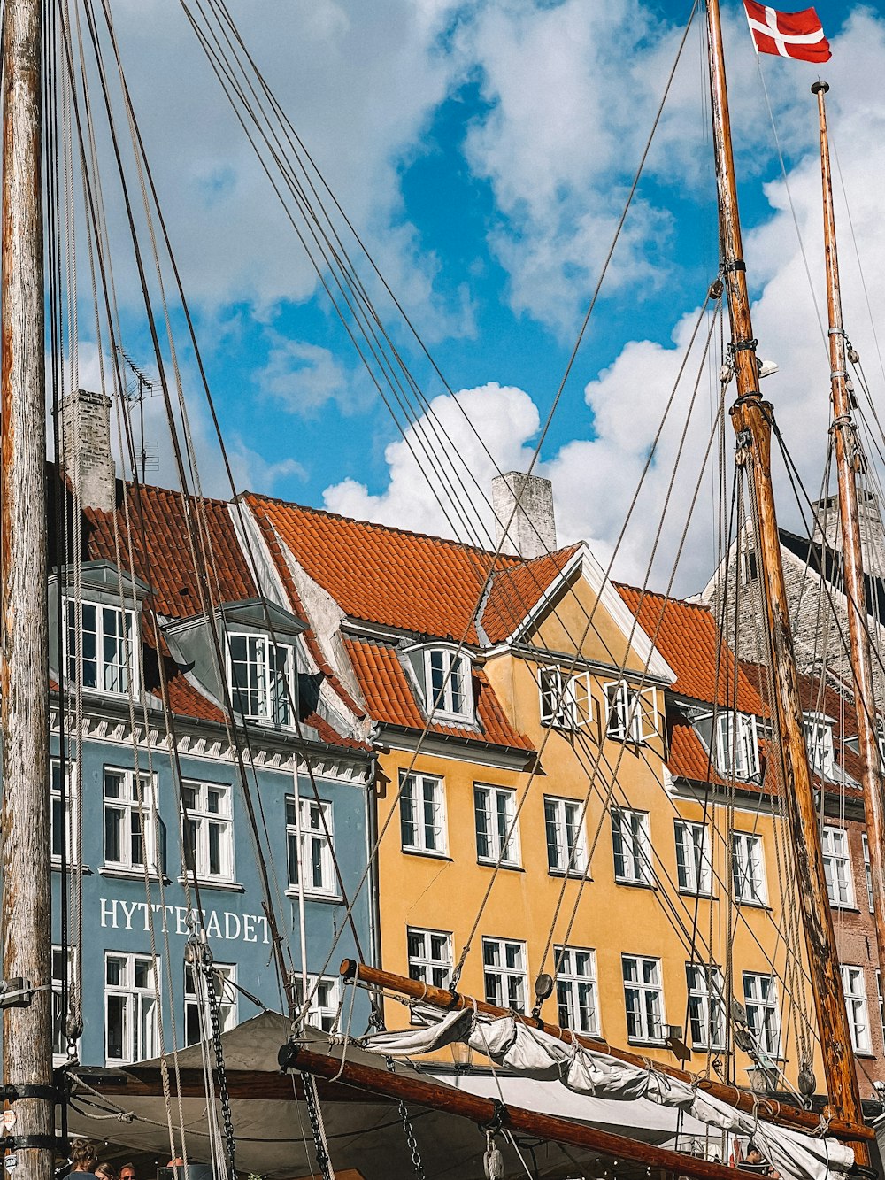 a row of buildings with a flag