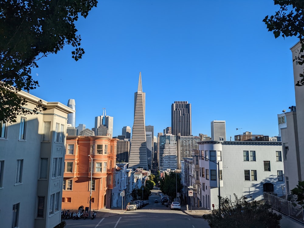 a city street with buildings and trees