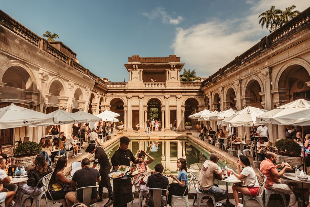 a group of people sitting at tables