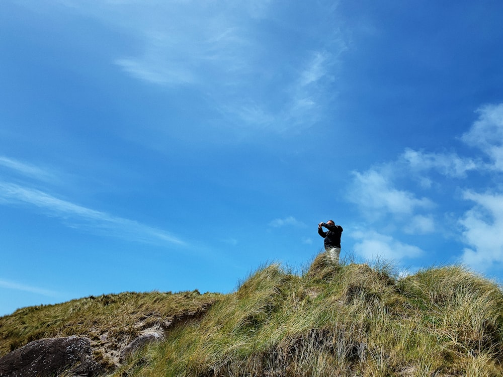 a person standing on a rock