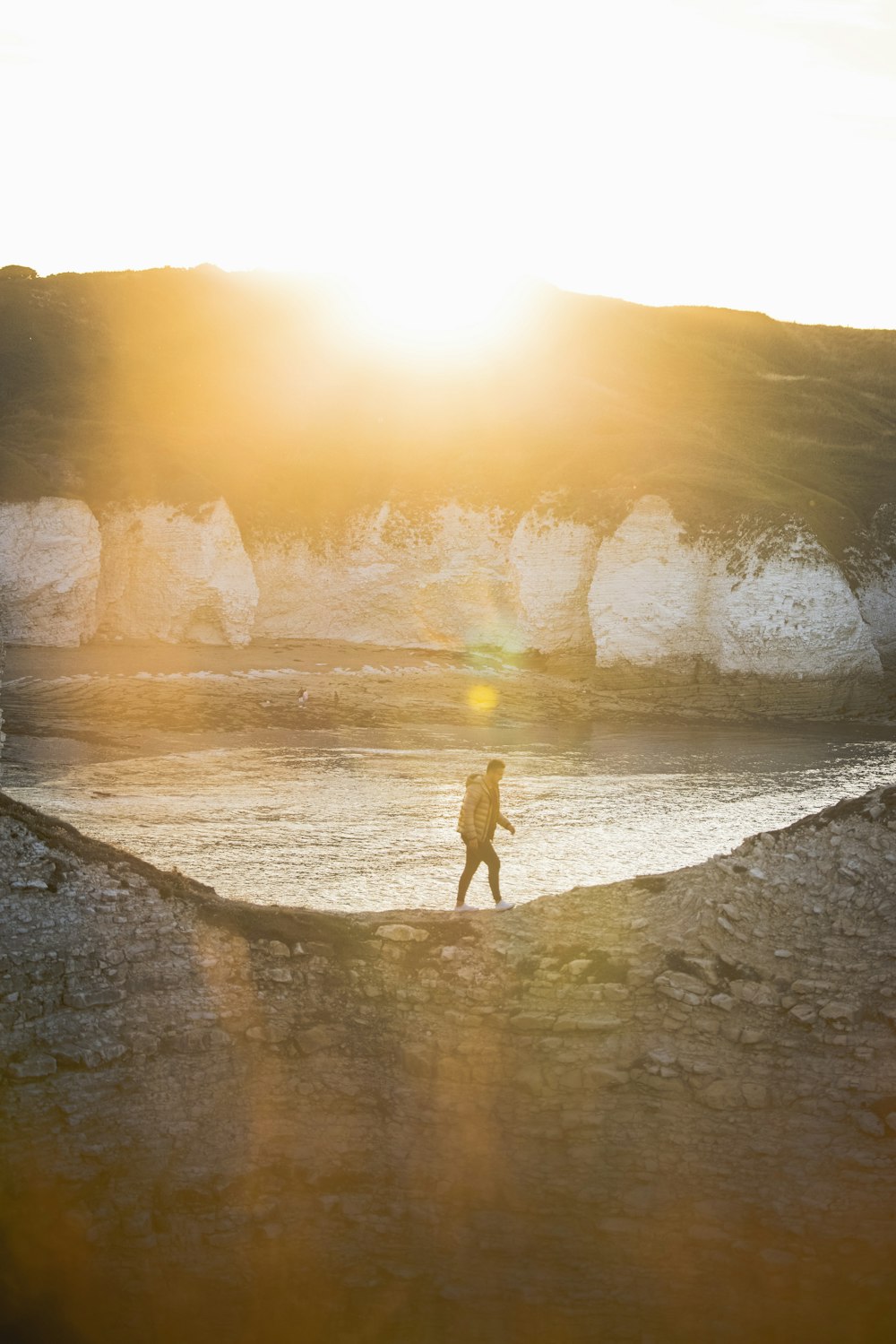 a person standing on a rock