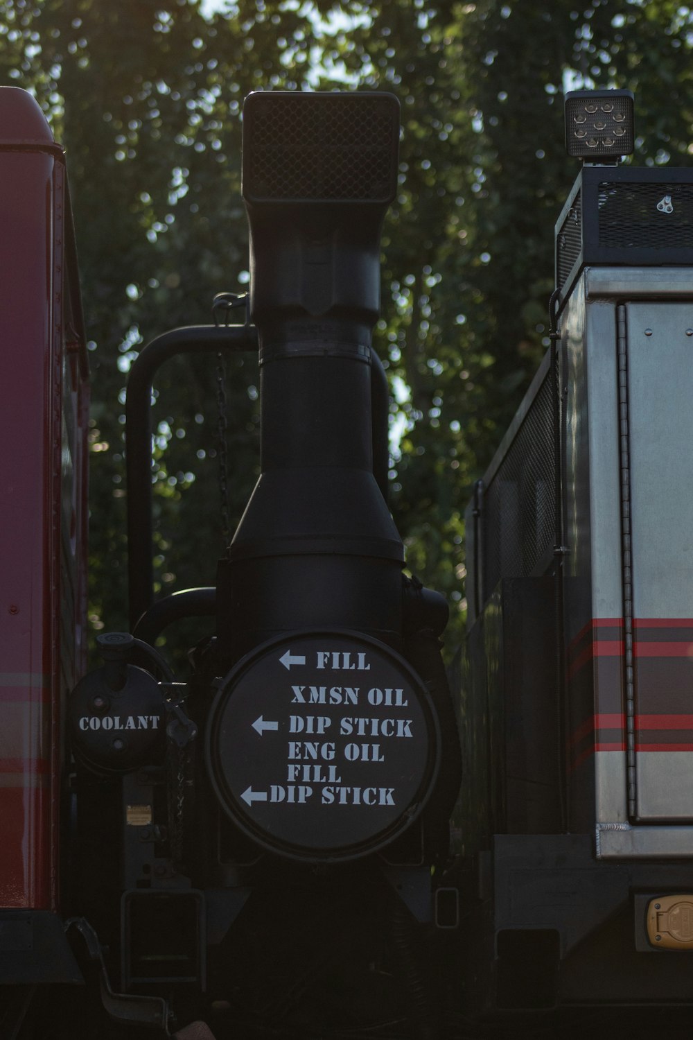 a black train with a large black object on top