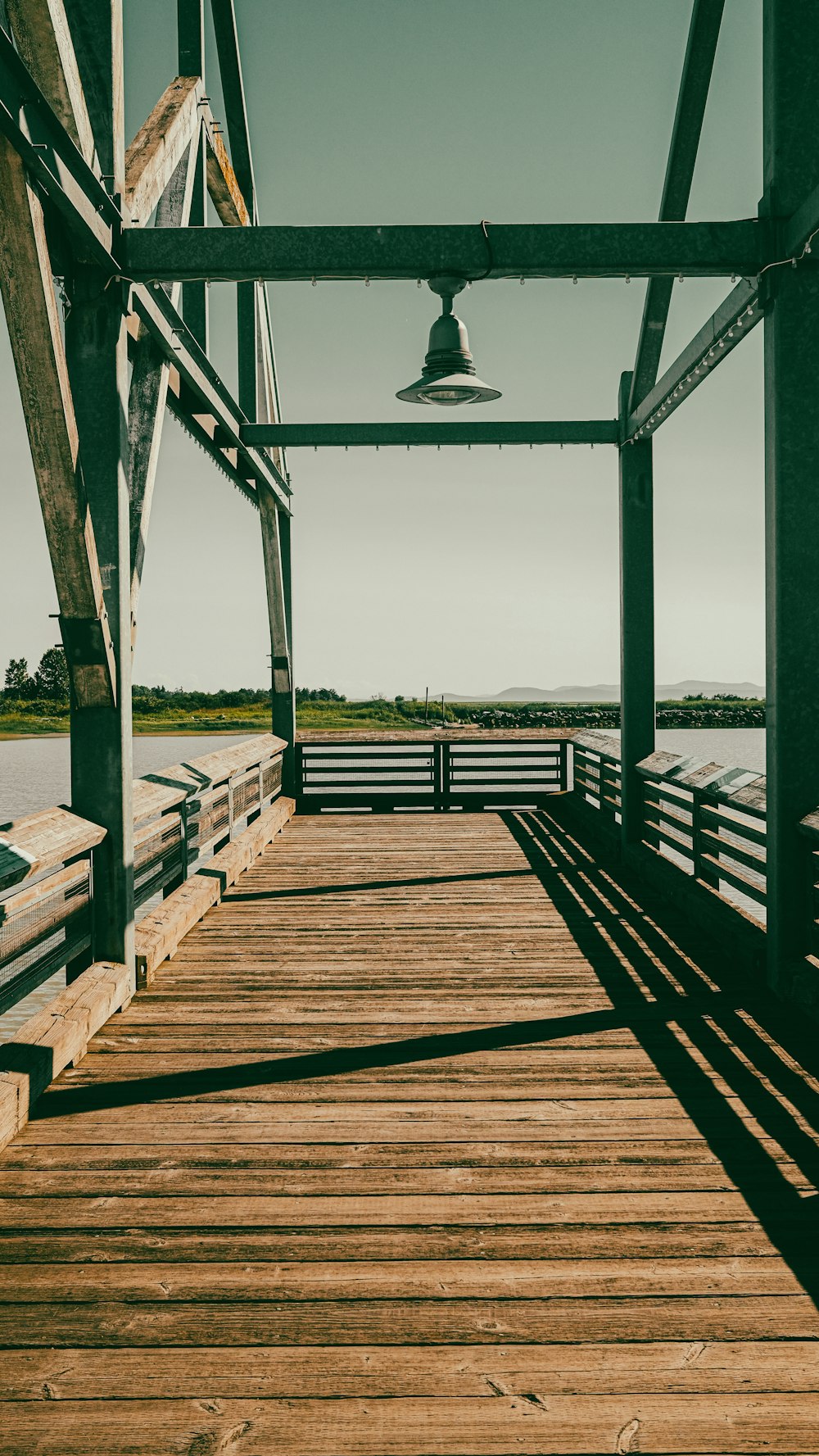 a wooden bridge with a light