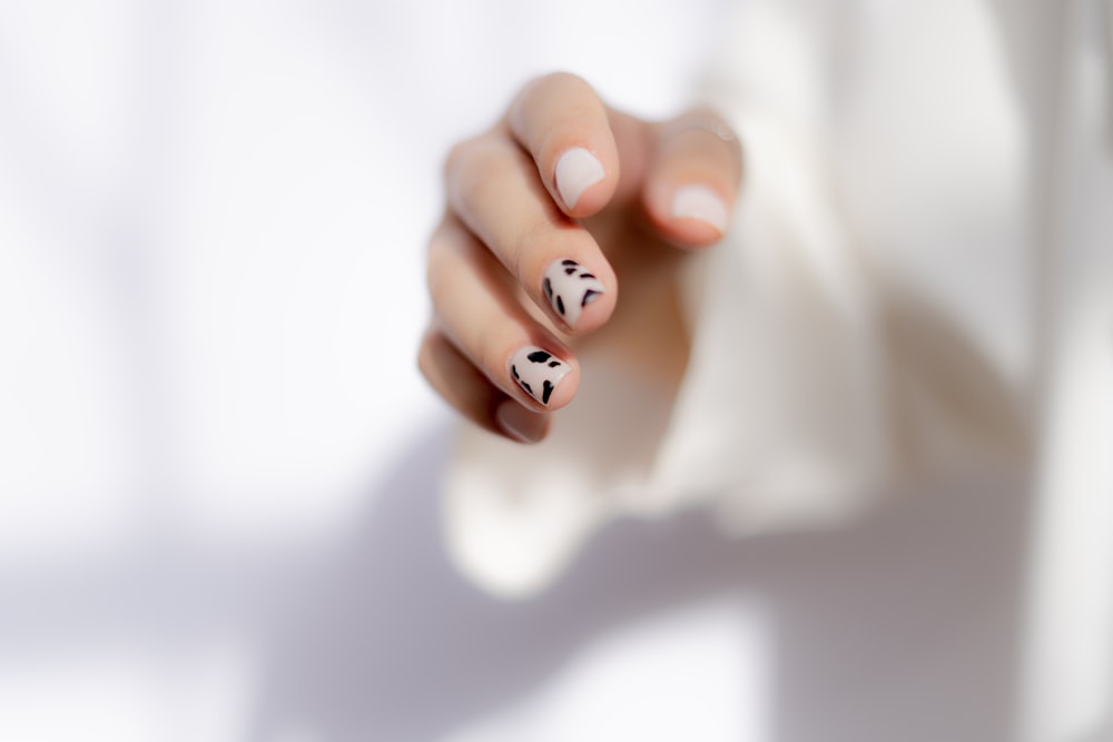 a hand with painted nails