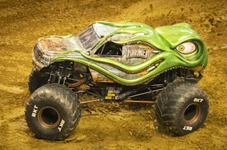 A collection of monster trucks with oversized wheels ready to crush.