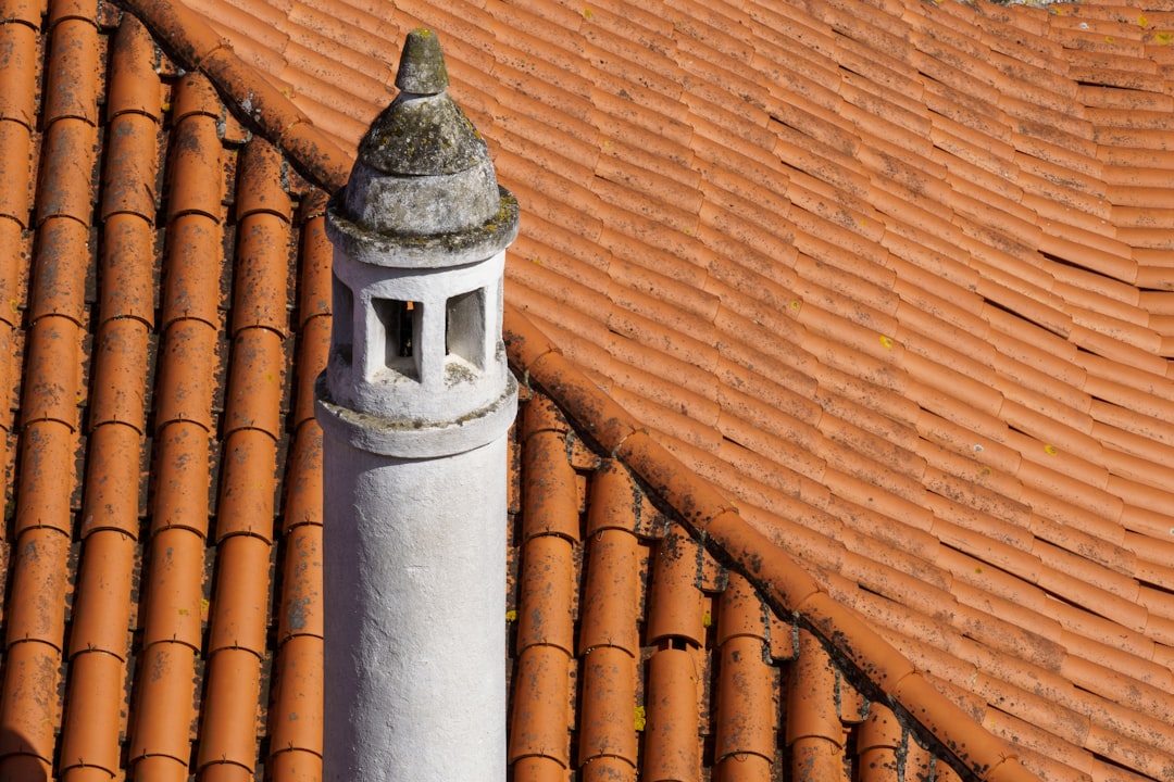 a metal pole with a statue on top of it,