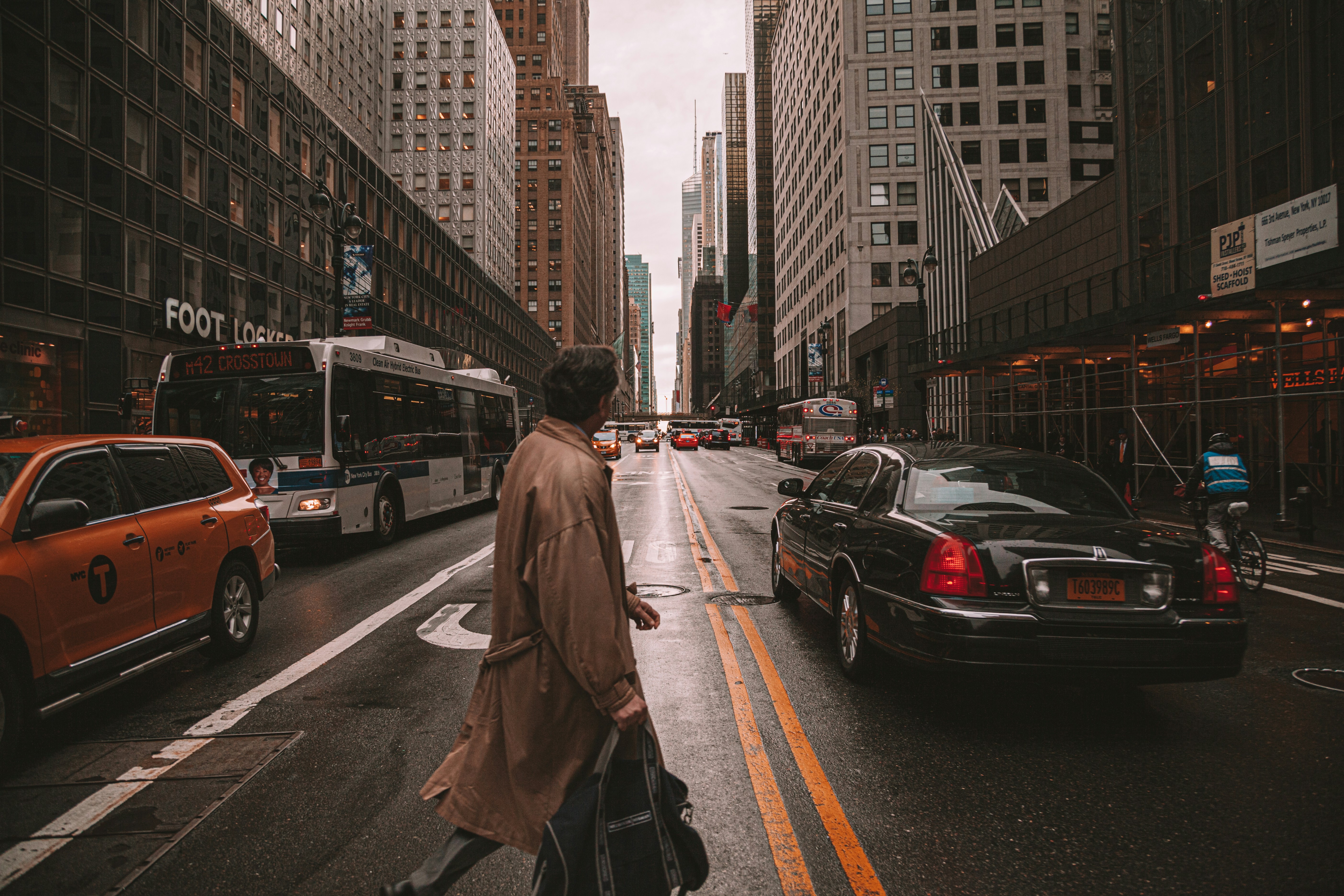 a person walking down the street with a suitcase
