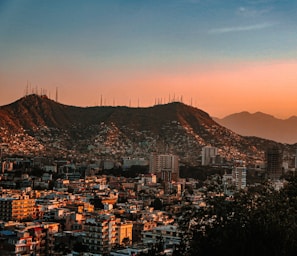 a city with mountains in the background