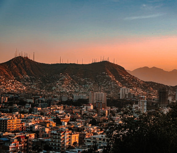 a city with mountains in the background