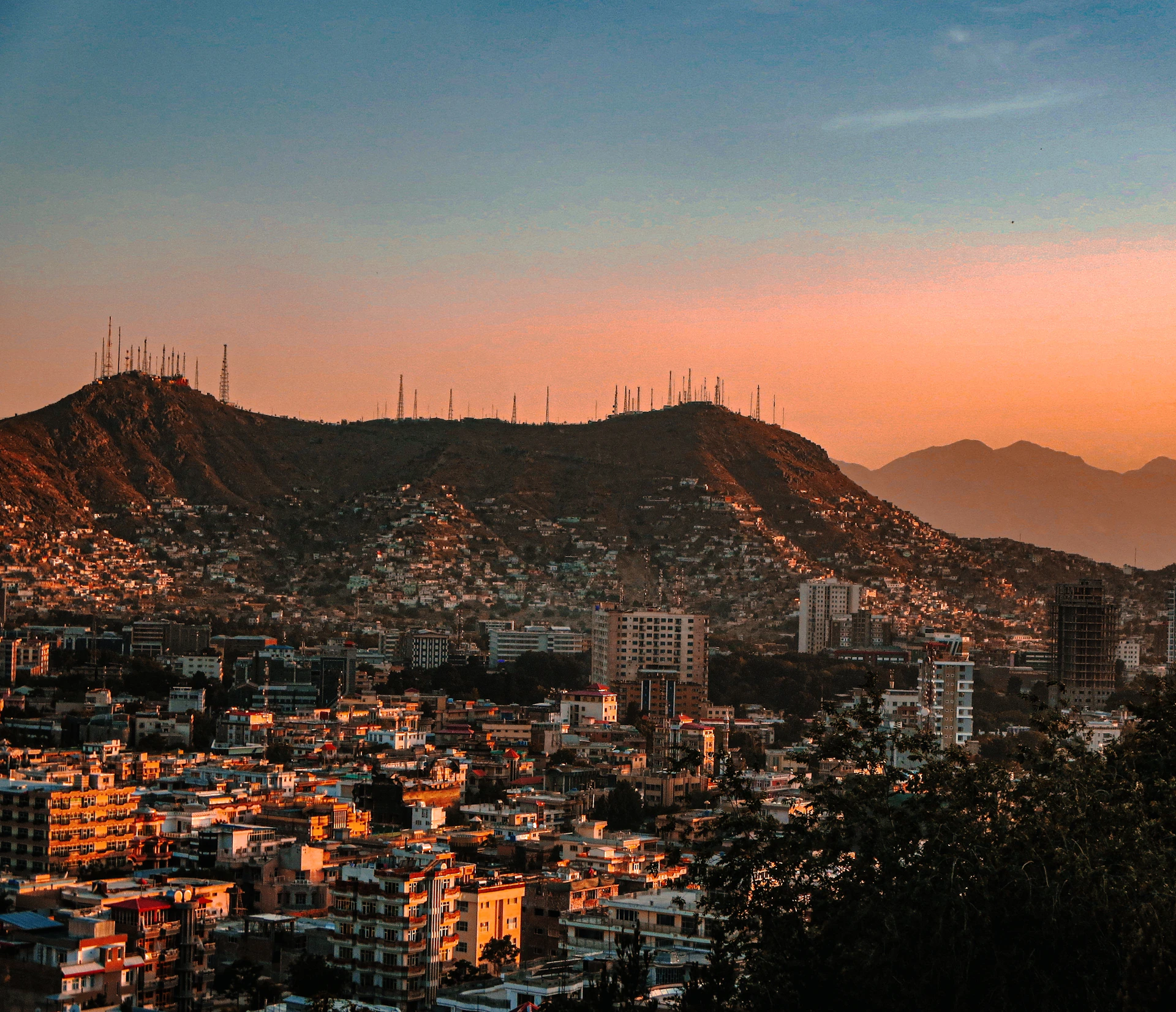 a city with mountains in the background