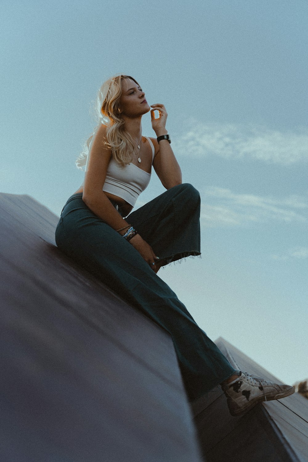 a woman sitting on a rock