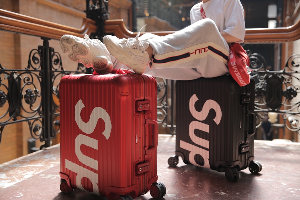 a person pushing a cart with a large bag on it