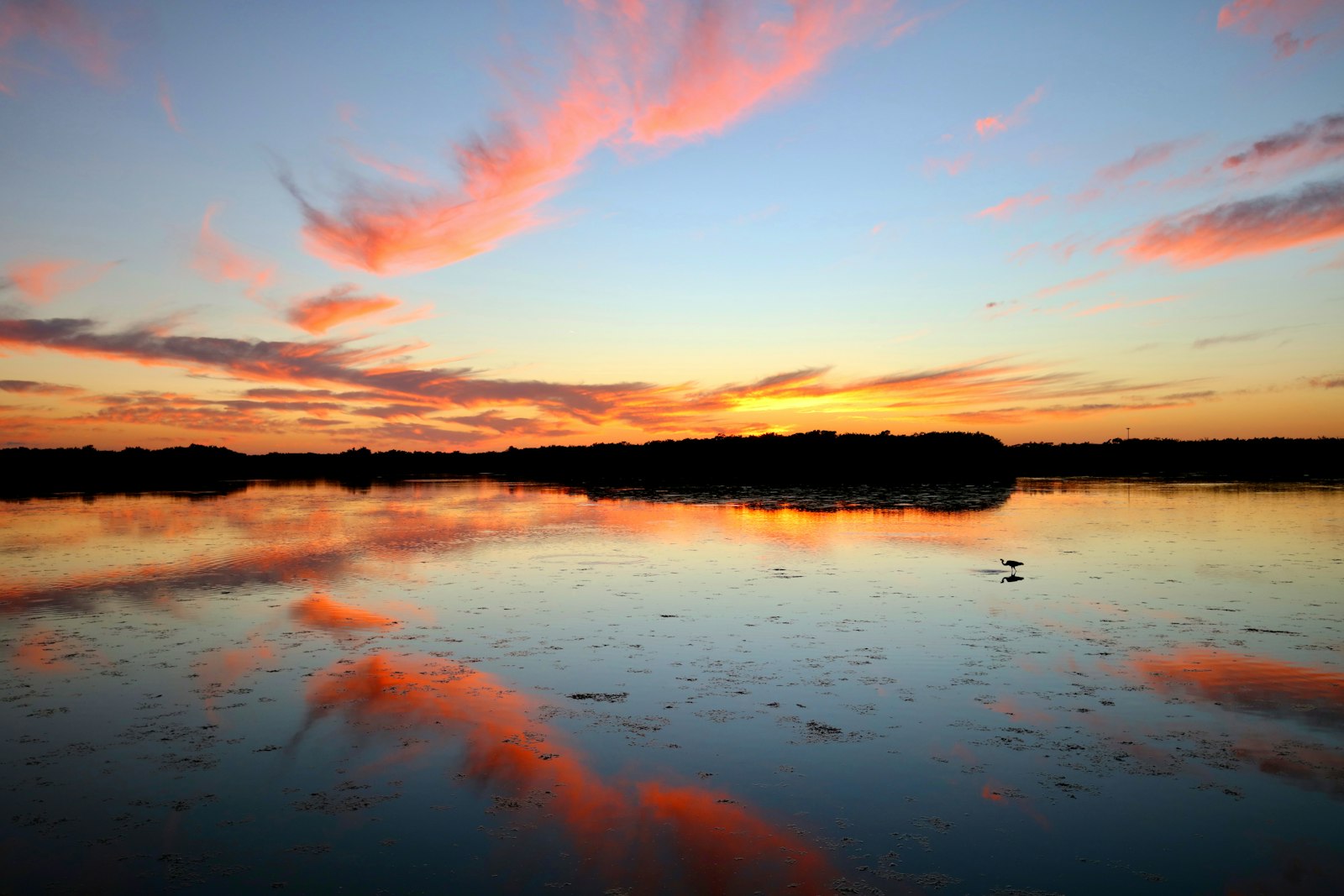 A sunset over a lake.
