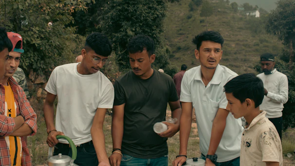 Group of enthusiastic youth attending a sustainable agriculture workshop outdoors