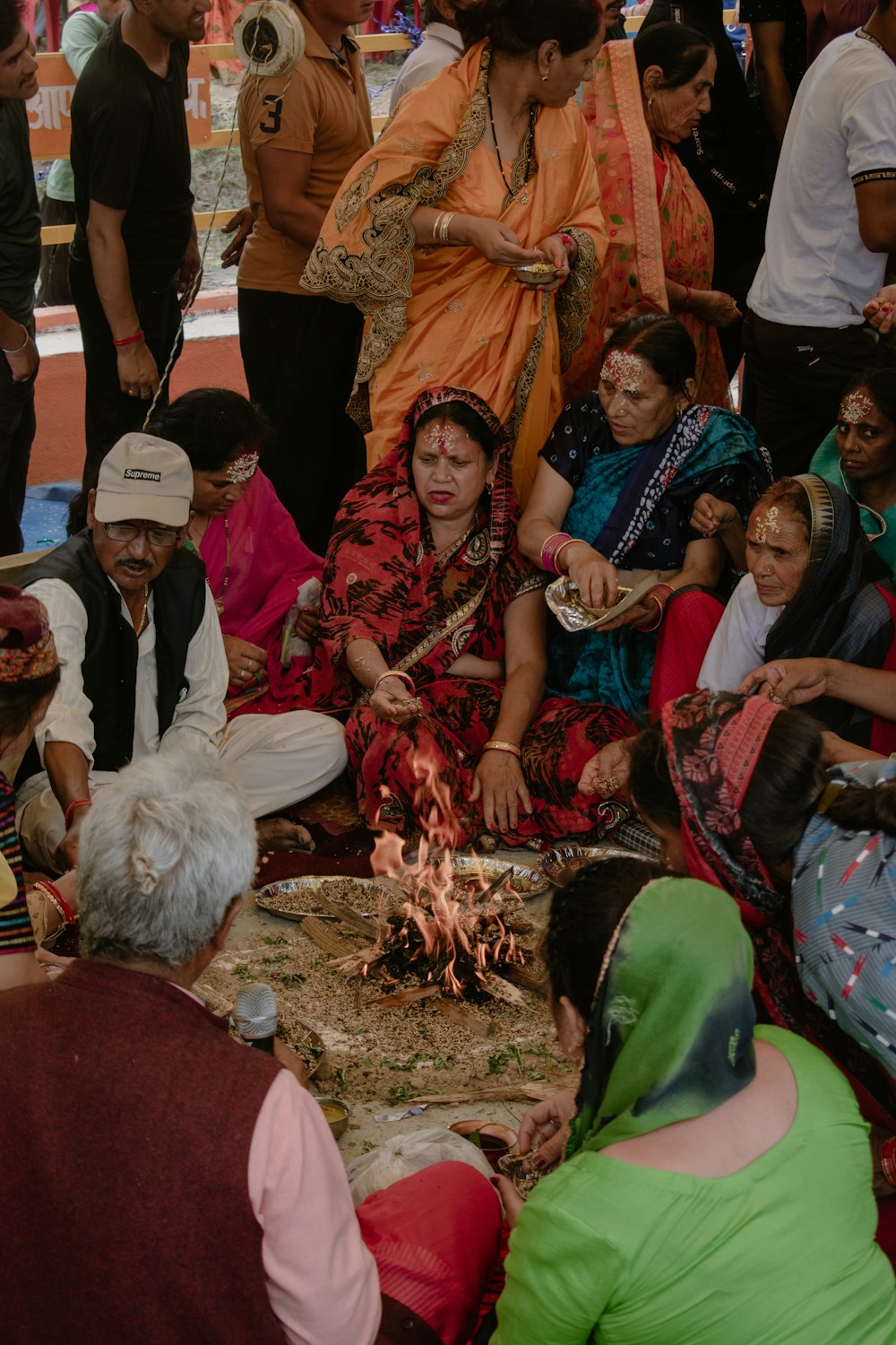 a group of people sitting on the ground