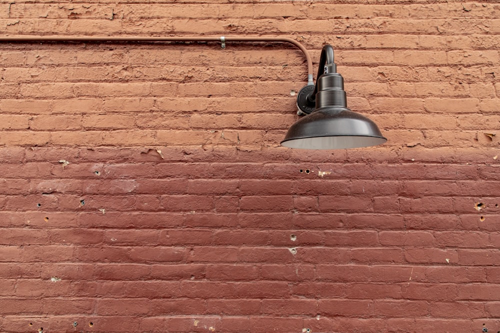 a bell on a brick wall