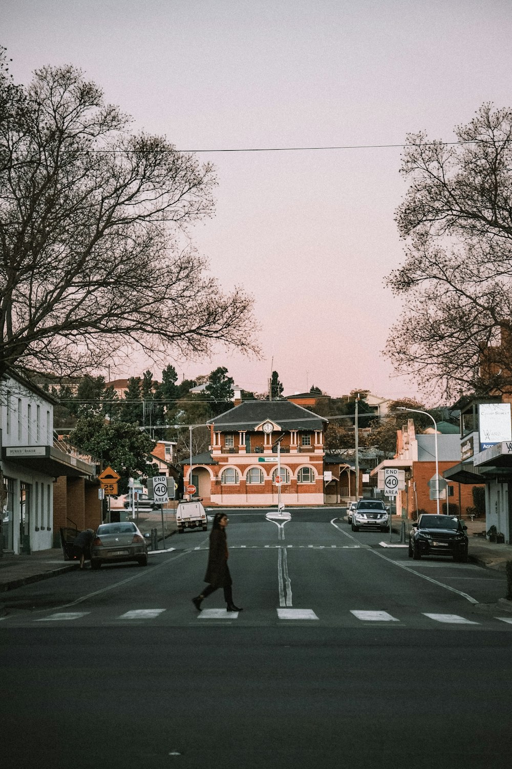 a person walking across a street