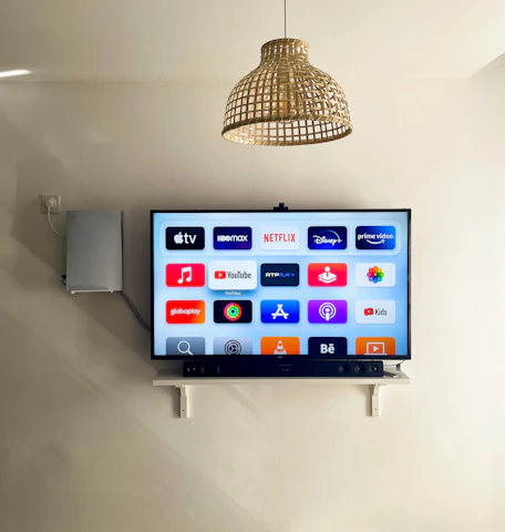 A vibrant streaming interface showing multiple playlists and video thumbnails in a cozy, modern living room setting.