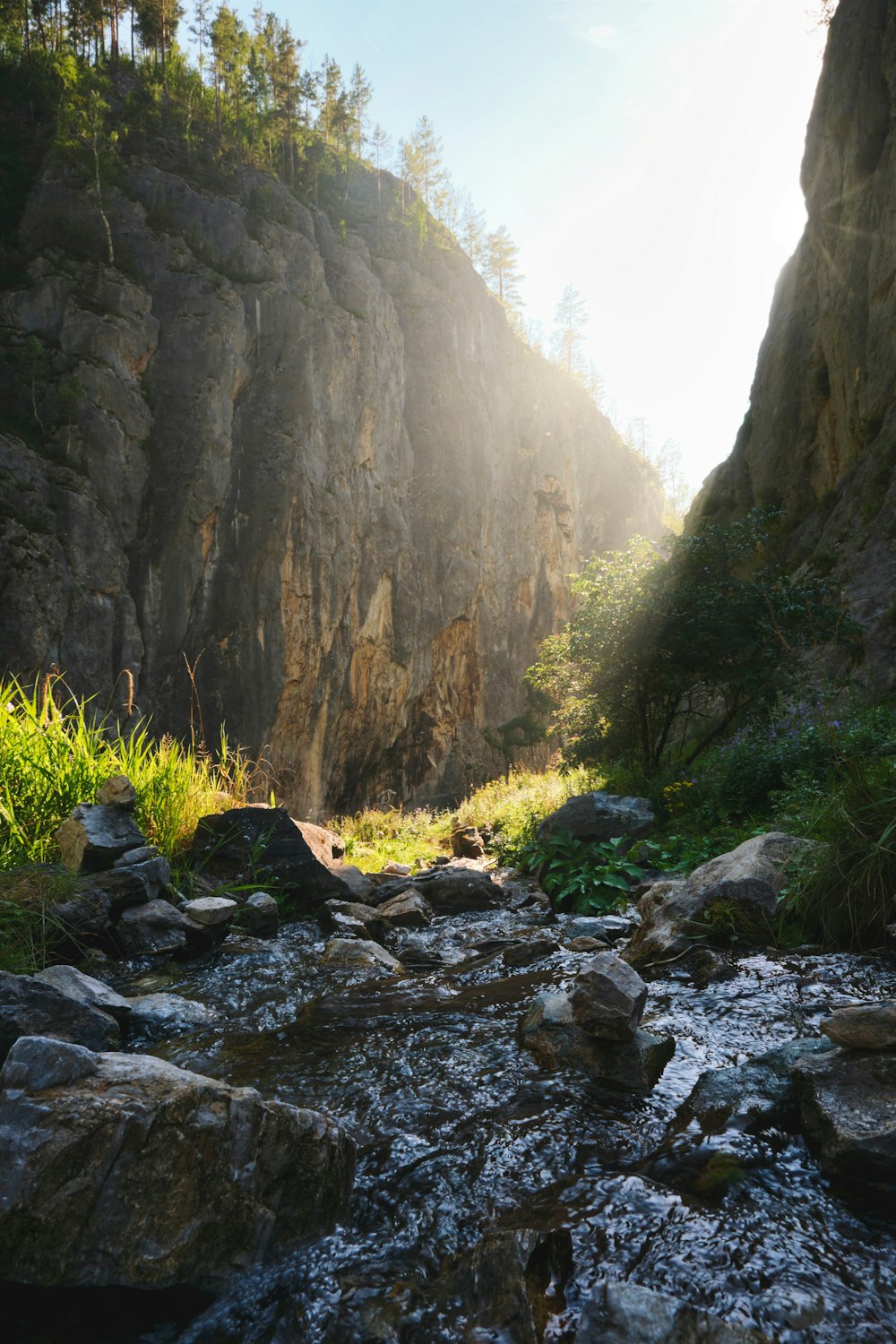 a rocky river with a waterfall