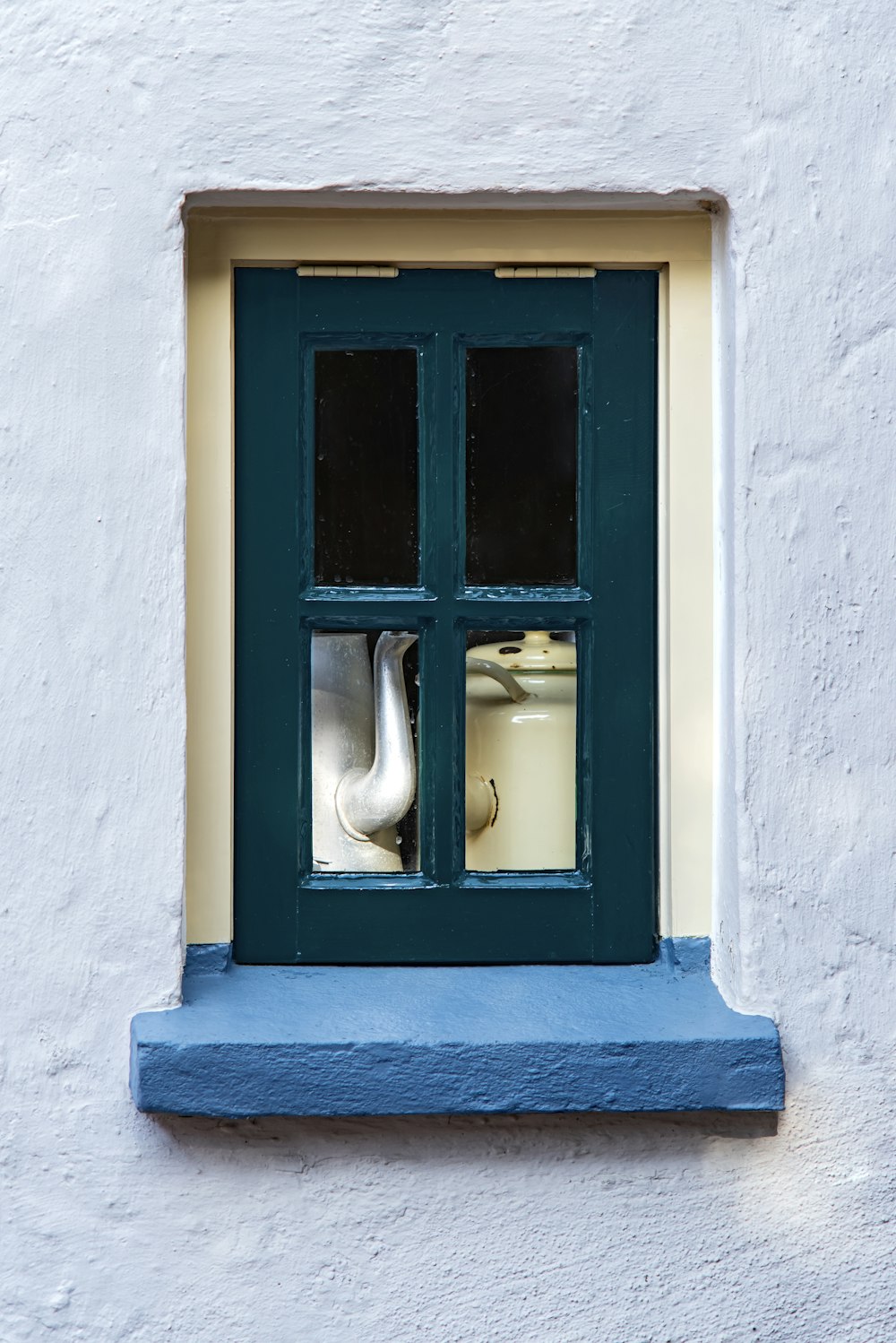 a window with a vase in it