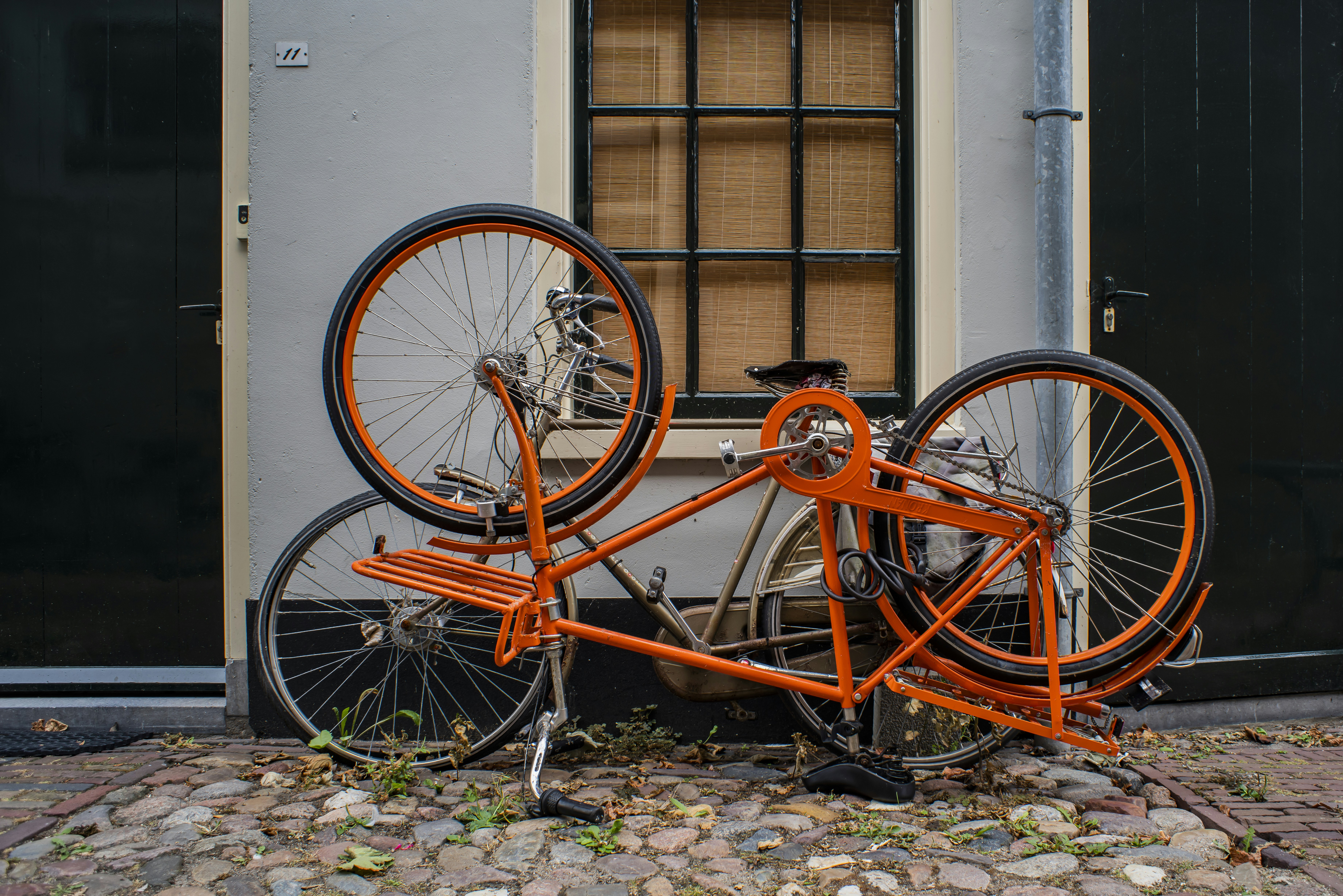 a bicycle with orange frame