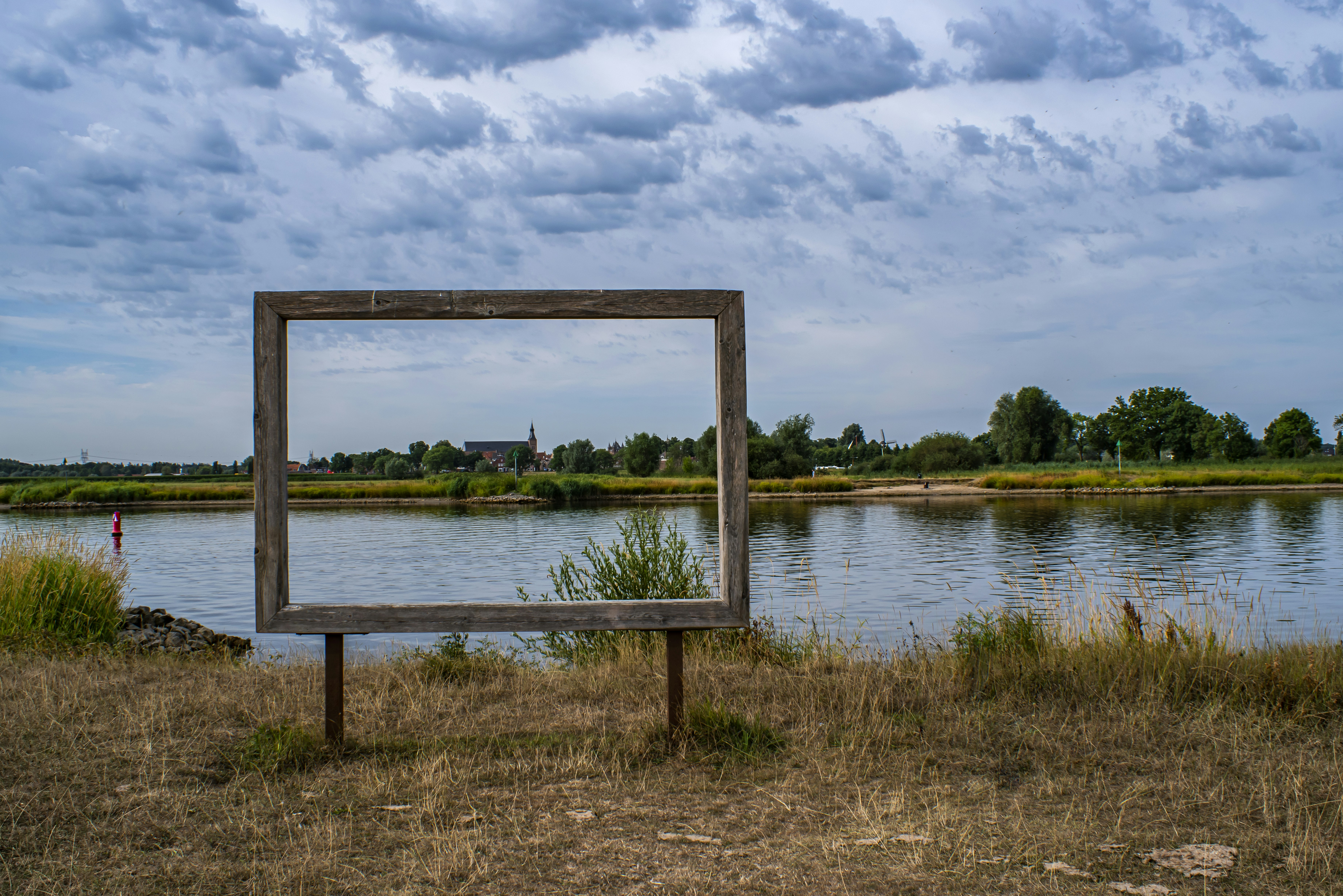a bench sits in front of a lake