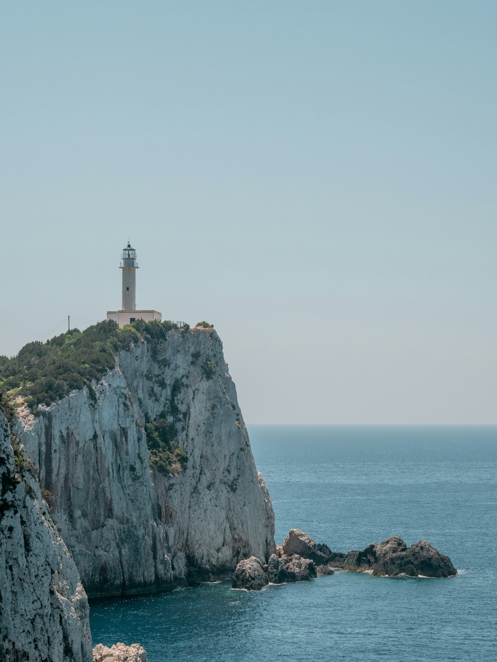 a lighthouse on a rocky cliff