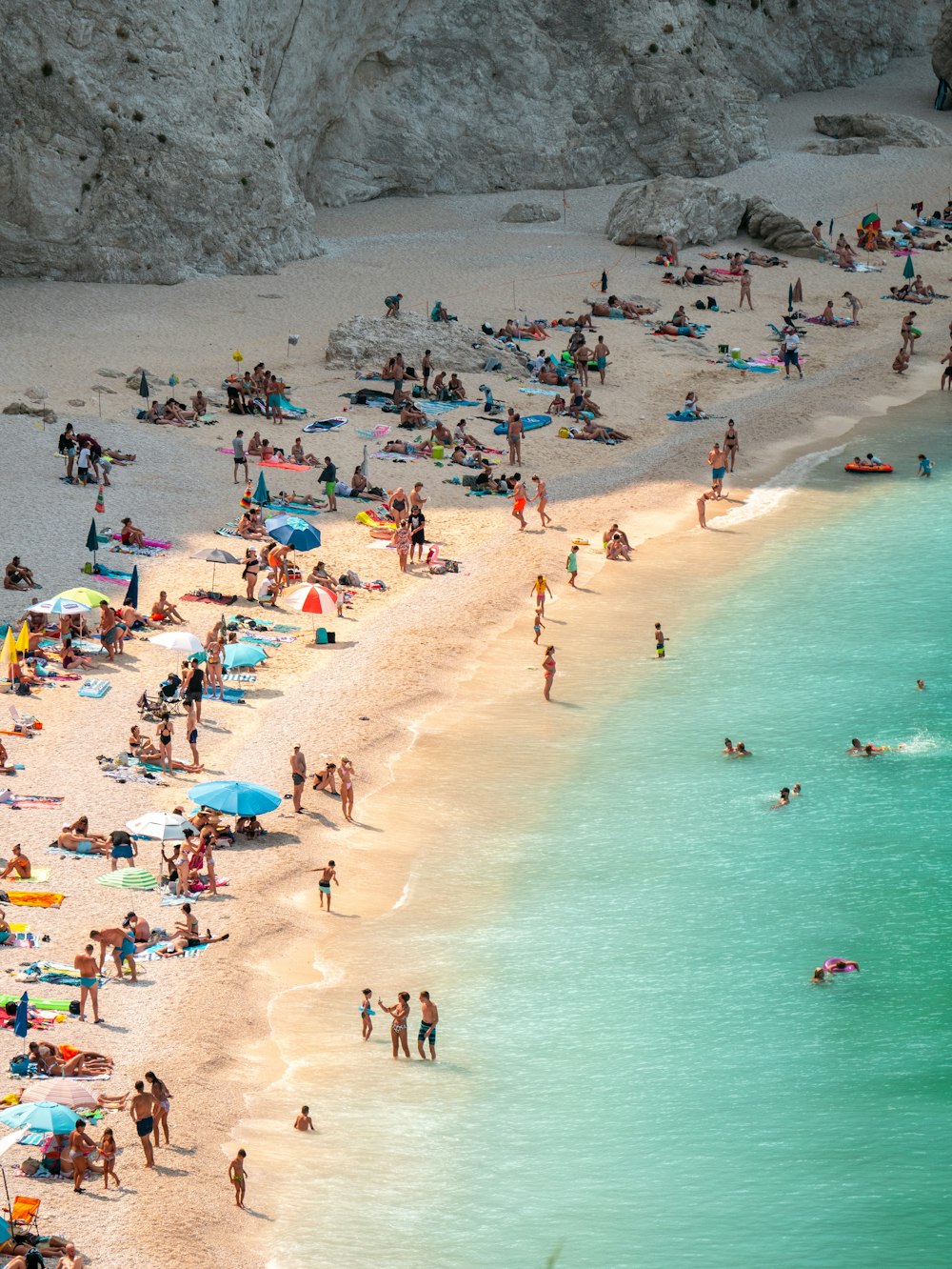 a crowded beach with people