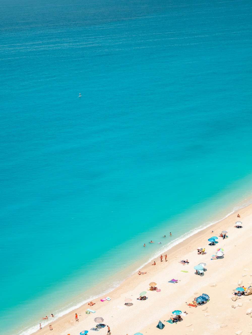 a beach with people on it