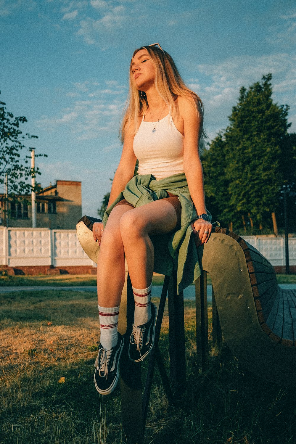 a person sitting on a large tire