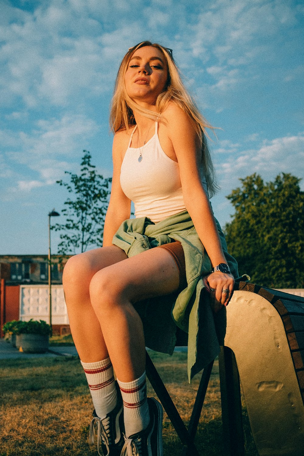 a woman sitting on a cannon