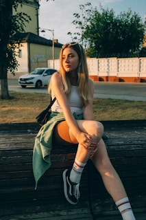 a woman sitting on a bench
