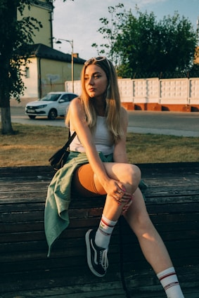 a woman sitting on a bench