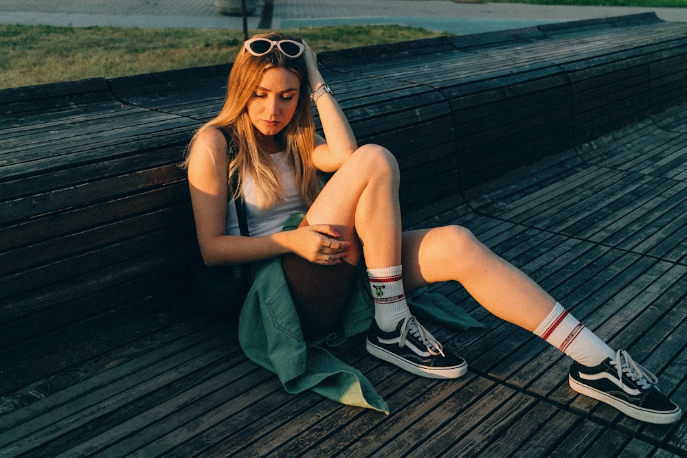 a woman sitting on a bench