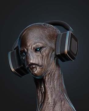 A creature with a textured, alien-like appearance is wearing large, black headphones. The figure's skin is a mix of earthy tones with intricate details and patterns. The creature's eyes have a glowing, piercing look.