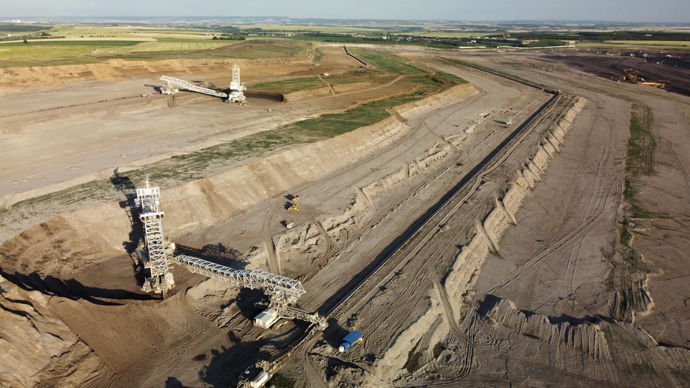 High-angle view of a construction site with roads and building footprints