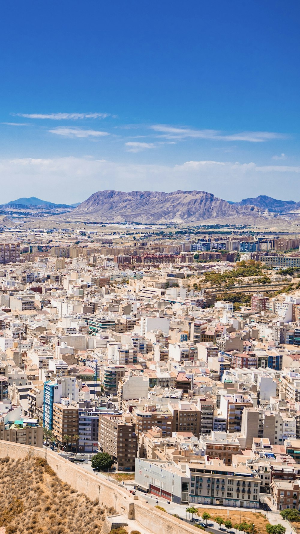 a city with mountains in the background