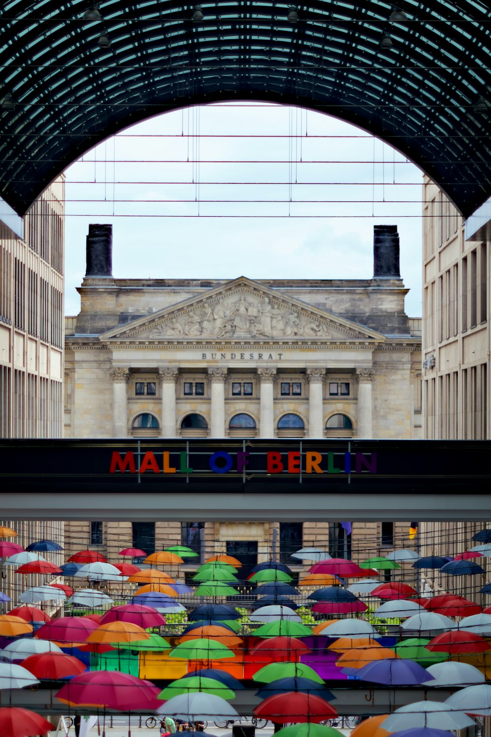 a group of umbrellas are placed in front of a building