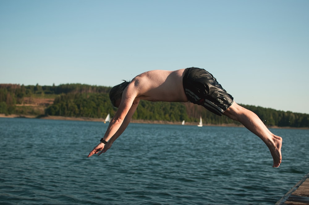 a man jumping into the water