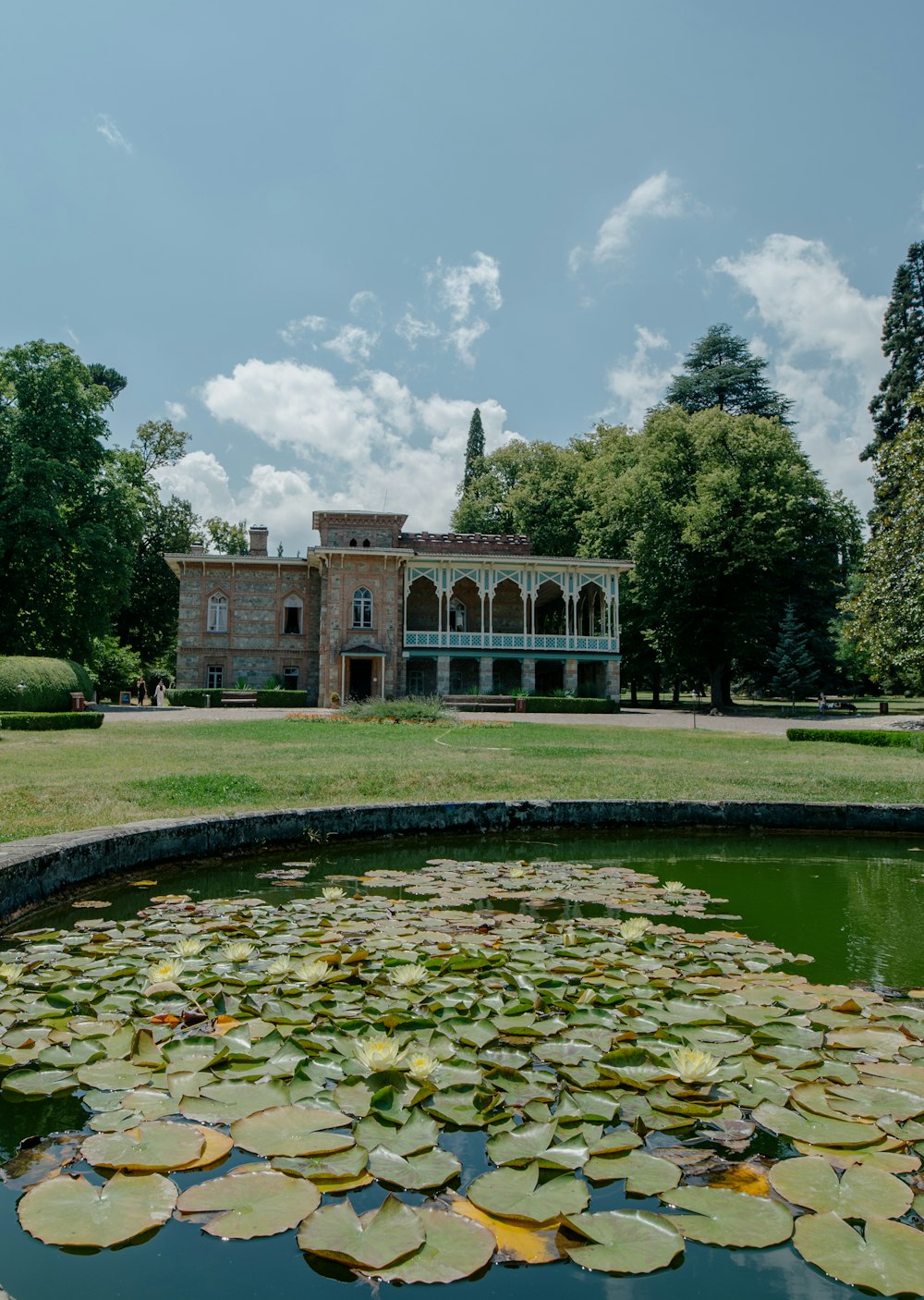 a building with a pond in front of it