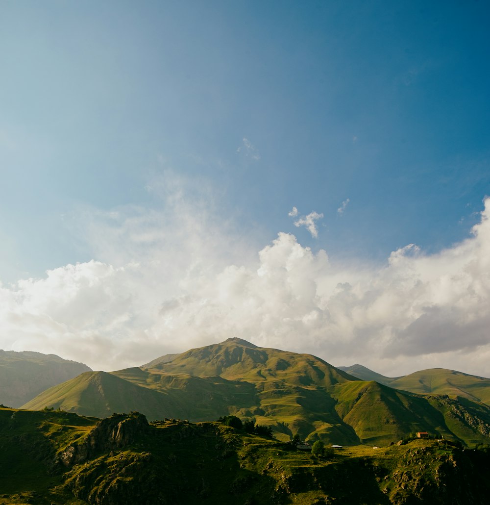 a mountain range with clouds