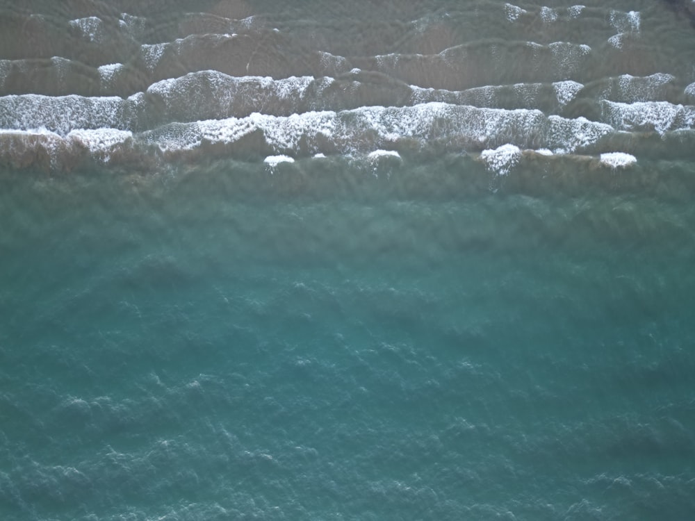 a body of water with ice and snow on it