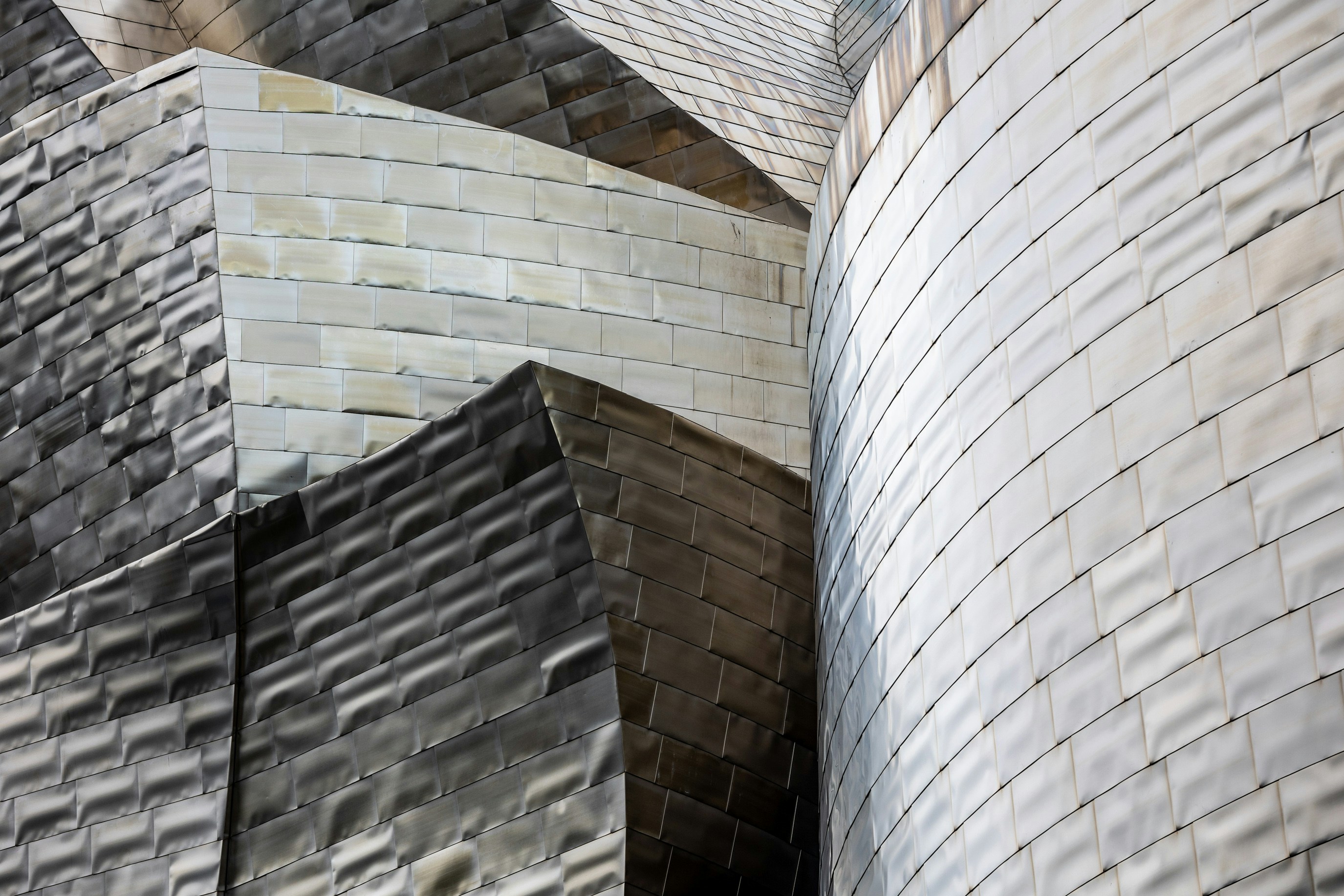 woman wearing yellow long-sleeved dress under white clouds and blue sky during daytime